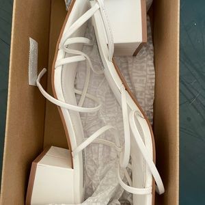 Steve Madden Remmi Hell Sandal. White leather shoe. 2 1/4 inch heel.